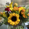 The Sunflowers and floral varieties used in this bouquet will vary based