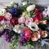 A gorgeous handtie bouquet, roses, hyacinths, anemones, stock, lots of beautiful blooms
