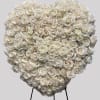 This spray is a heartfelt tribute, using all white roses it signifies