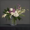 An elegant mix of hydrangea. calla lily, roses, orchids and scabiosa with