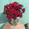This small tasteful arrangement uses smaller spray roses to create a look