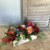 A bountiful holiday centerpiece to grace your table. Designed in a rustic