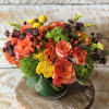 An electrifying collection of vibrant autumn colors with flowers such as roses