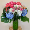 Roses , Hydrangeas, Tulips , green in tall glass vase