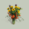 This beautiful arrangement is made up of sunflowers, spray pumpkins, bupleurum, safari