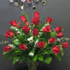 Long stem roses in vase with beautiful foliage. 