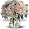 Soft as a whisper, this elegantly feminine vase of delicate pink and