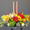 This centerpiece arrangement is sure to brighten up any fall celebration. 