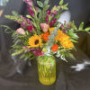 Designed using pinky burgundy snapdragons, sunflowers, pink lisianthus, queen anne&#039;s lace, and