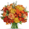 Bring the warm glow of autumn indoors with this radiant bouquet. Featuring