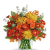 Bring the warm glow of autumn indoors with this radiant bouquet. Featuring