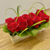8 red roses in a fancy wood basket 