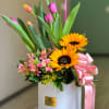 Box with nice tulips with sunflowers for a special ocassion