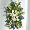 A collection of bold blue flowers shares a tribute that words cannot