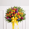 One-sided standing basket arrangement with orange roses and Asiatic lilies, golden sunflowers