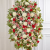 One-sided standing spray arrangement with red roses and Matsumoto asters, pink Stargazer