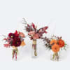 A variety of beautiful autumn blooms and foliage in mixed heights arranged