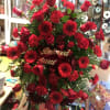 This elegant, all red funeral spray conveys compassion and deep devotion. Presented