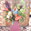 Inspired by modern style and wedding bouquets, this arrangement uses rustic colors