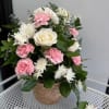 The Blush Meadow arrangement brings a touch of quiet, natural charm to