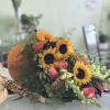 Sunflowers,Orange Roses, Yellow Snapdragons,Solid Aster,Rust china Mum, Eucalyptus, Plumosa, Lemon Leaf.