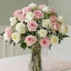 24 roses in pink and white with white wax flower