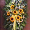 Lush spray overflowing. With sunflowers, yellow roses, holland delphinium accented whites and