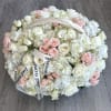 Delicate bouquet of white hydrangeas and pink spray roses, creating a soft
