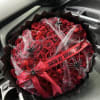 Terrifyingly romantic bouquet, made up of 100 red roses, spider web, and