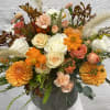 Elegant fall style floral arrangement in an artisan ceramic vase.