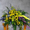 Sunflowers, liatris, orchids and blue delphinium designed to remember your loved one