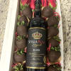 12 chocolate strawberries, 8 red roses &amp; wine bottle