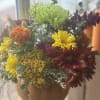 Celebrate the season with a handcrafted fall arrangement designed in an 8&quot;