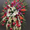 This Grand and Beautiful standing spray, made with purple and white dendrobium