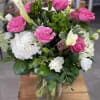 Tall vase arrangement with seasonal blooms and the most beautiful roses on