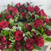Red rose and spray rose urn wreath with beautiful greenery