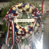 Beautiful Sympathy Wreath 
Red , white and blue . 