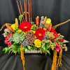 Rustic box of fall flowers, some roses and lots of texture. Colors