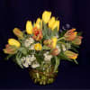 An assortment of 15 local grown tulips arranged with greenery and premium
