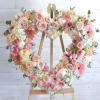 A graceful expression of love and remembrance, this open heart wreath features