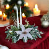 Elegant winter design by Chaney&lsquo;s with fresh Christmas greens, decoration and candles.