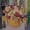 Brighten your autumn celebrations with our Limited Edition Fall Pumpkin Floral Arrangement!