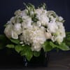 This luxury arrangement contains mixed florals such as roses, hydrangeas, lisianthus and