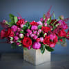 This luxury arrangement contains mixed red and pink florals such as roses