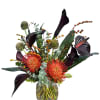A captivating and unique arrangement that combines dramatic, deep hues with fiery