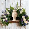 Honor cherished memories with a graceful floral arrangement designed to encircle an