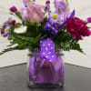 This cheerful and fun arrangement featuring polka dots is sure to put