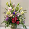 Our Vibrant Remembrance arrangement honors your loved one with vivid colors and