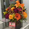 Basket is 5&rdquo; wide opening. Mixed with fall flowers including marigolds or