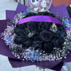  24 black roses wrapped in a buch&oacute;n style bouquet is exactly